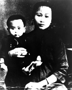 Sewing-Woman-with-first-born-son,-ca-1940,-China